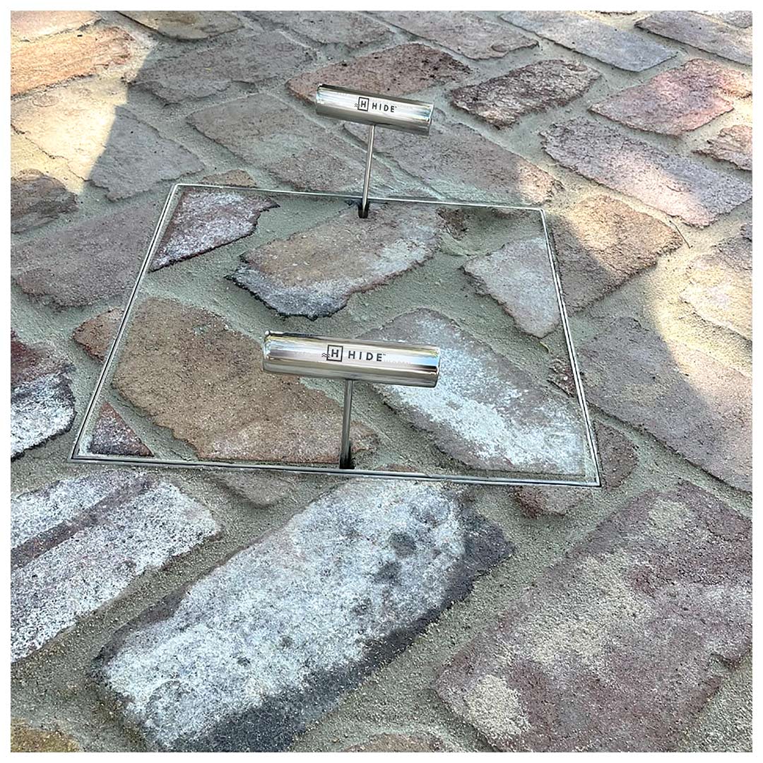 HIDE Access Cover with recycles brick inlay covering service access point underneath.