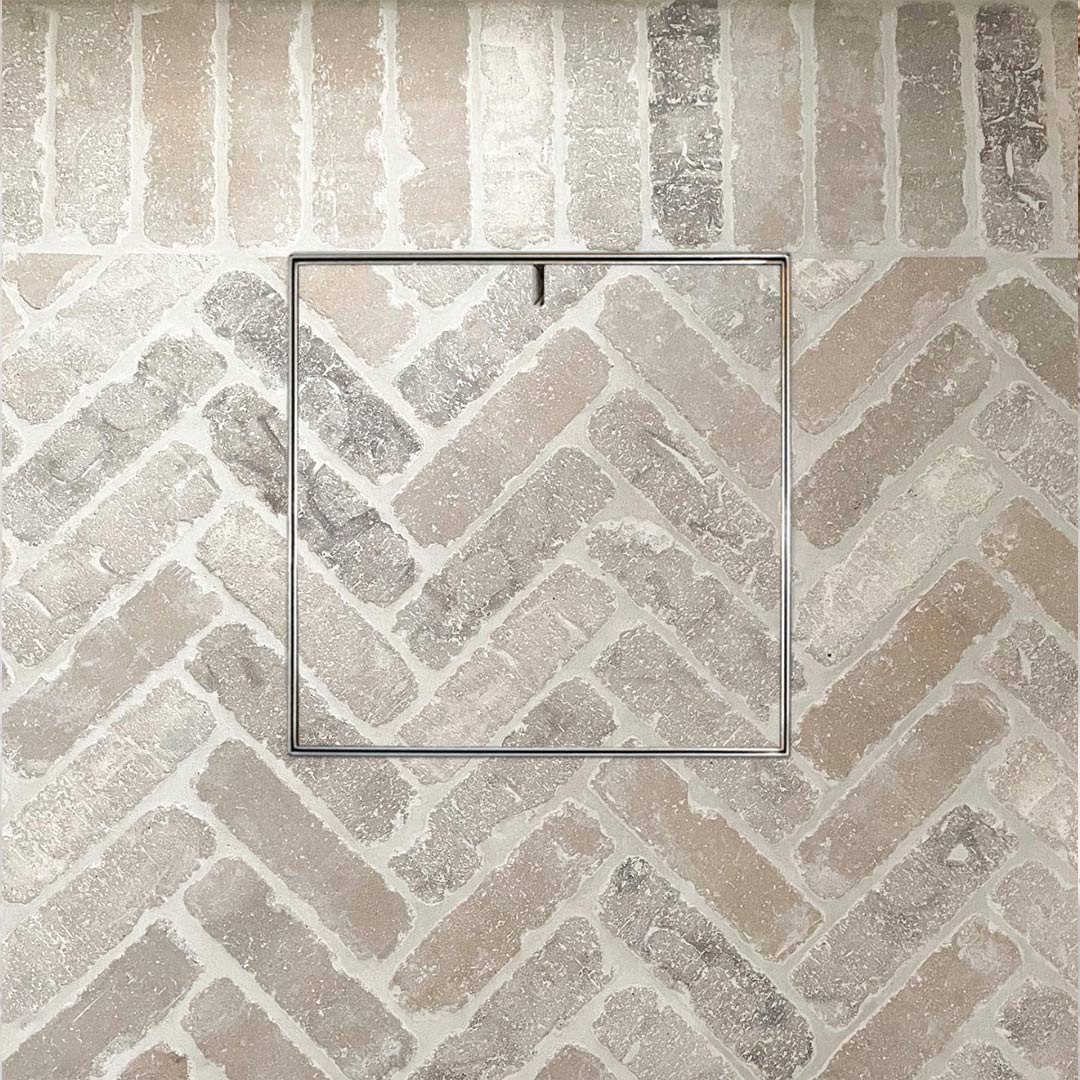 Amazing HIDE Access Cover with matching brick infill in herringbone pattern